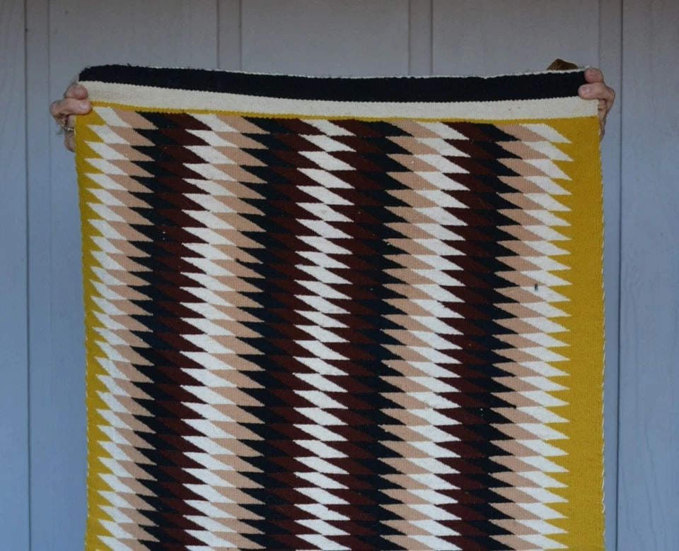 LENA BEGAY - NAVAJO RUG EYEDAZZLER - HUBBELL TRADING POST TAG - 44" X 25.5": LENA BEGAY - NAVAJO RUG EYEDAZZLER - HUBBELL TRADING POST TAG - 44" X 25.5" This Vintage striped Eyedazzler rug was woven by Navajo weaver Lena Begay. It comes with the original Hubbell Trading Post t
