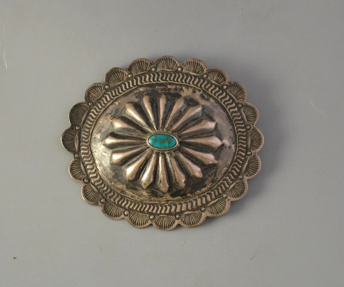 OLD PAWN NAVAJO INDIAN SILVER HAND STAMPED CONCHO BARRETTE - TURQUOISE - 3 1/4": OLD PAWN NAVAJO INDIAN SILVER HAND STAMPED CONCHO BARRETTE - TURQUOISE - 3 1/4" This beautifully crafted Navajo concho barrette is set with a wonderful turquoise stone. It measures 3 5/8" across by 3"