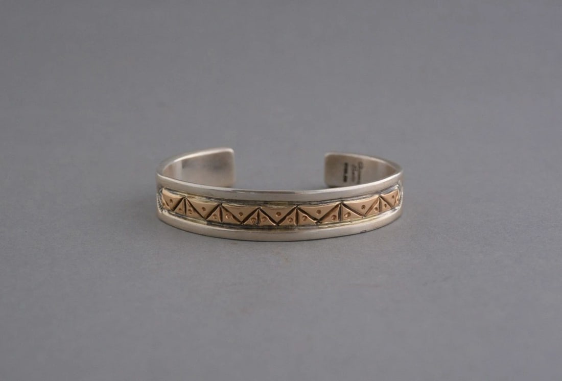 CHIMNEY BUTTE - VINTAGE HOPI SILVER BRACELET - HAND CHISELED INLAY - 7 3/8": CHIMNEY BUTTE - VINTAGE HOPI SILVER BRACELET - HAND CHISELED INLAY - 7 3/8" This vintage sterling silver bracelet with inlay has been crafted by Hopi silversmith Chimney Butte. The inlay is sterling s