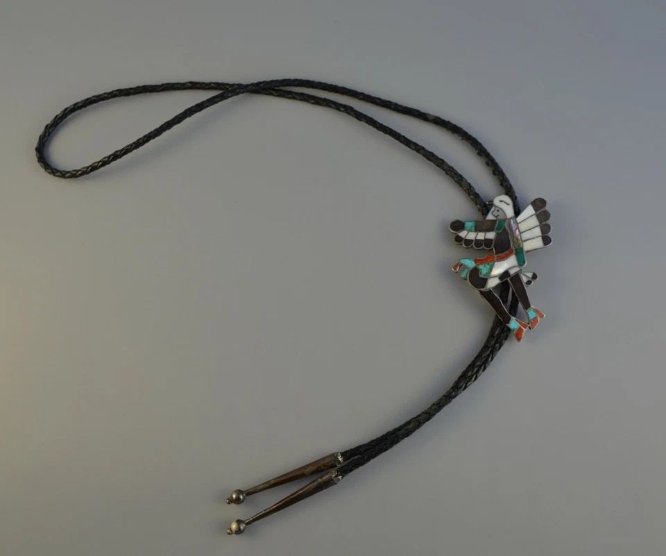 OLD PAWN ZUNI STERLING SILVER INLAY BOLO TIE - EAGLE DANCER - WILLIAM ZUNIE: OLD PAWN ZUNI STERLING SILVER INLAY BOLO TIE - EAGLE DANCER - WILLIAM ZUNIE Item Description: This vintage bolo tie has been beautifully crafted by Zuni artist William Zunie. It shows an Eagle dancer 