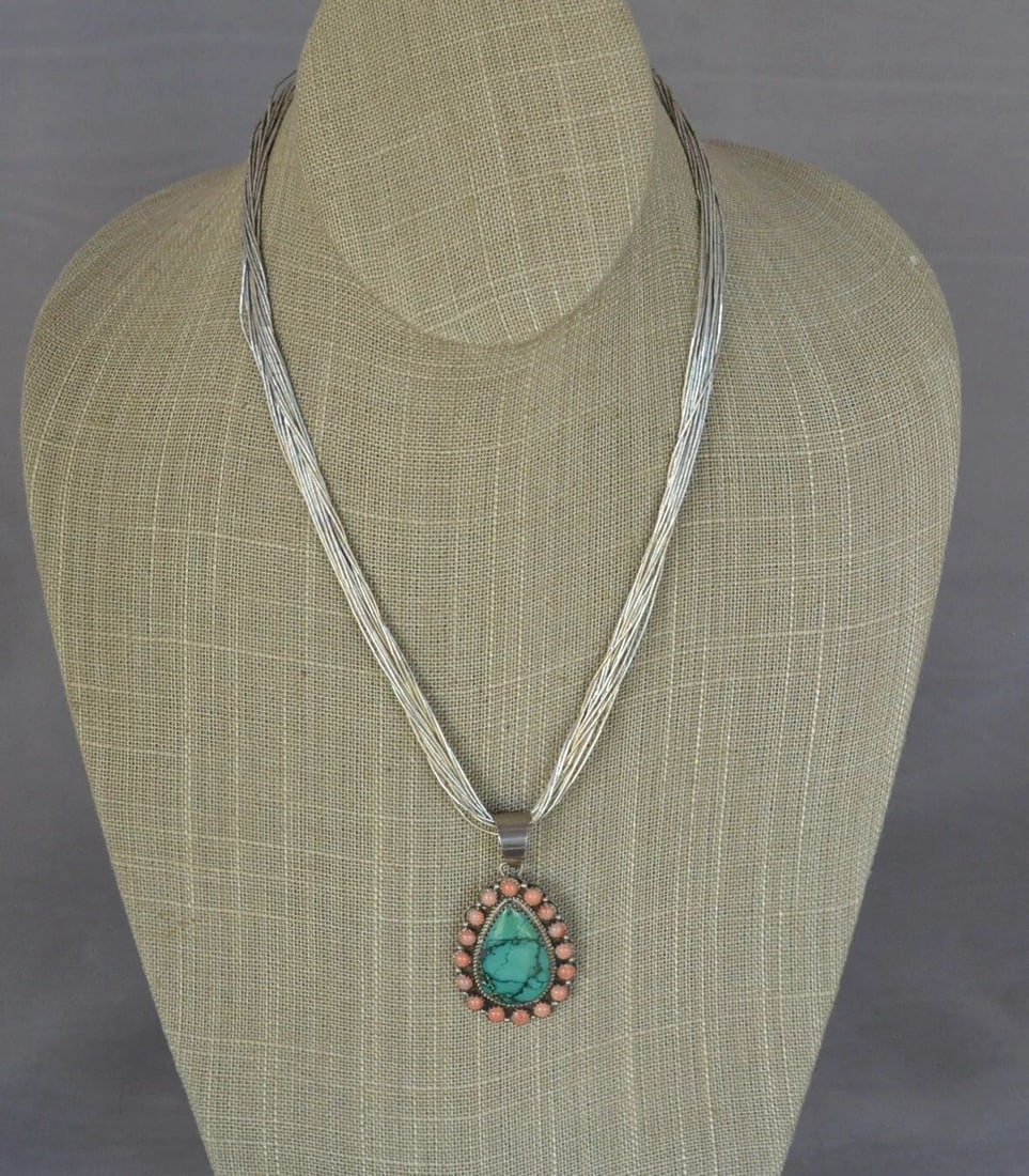 NAVAJO NECKLACE ANGEL SKIN CORAL TEARDROP TURQUOISE PENDANT LIQUID SILVER 18": NAVAJO NECKLACE ANGEL SKIN CORAL TEARDROP TURQUOISE PENDANT LIQUID SILVER 18" This beautifully crafted Navajo necklace has a teardrop turquoise stone surrounded with angel skin coral stones. The penda