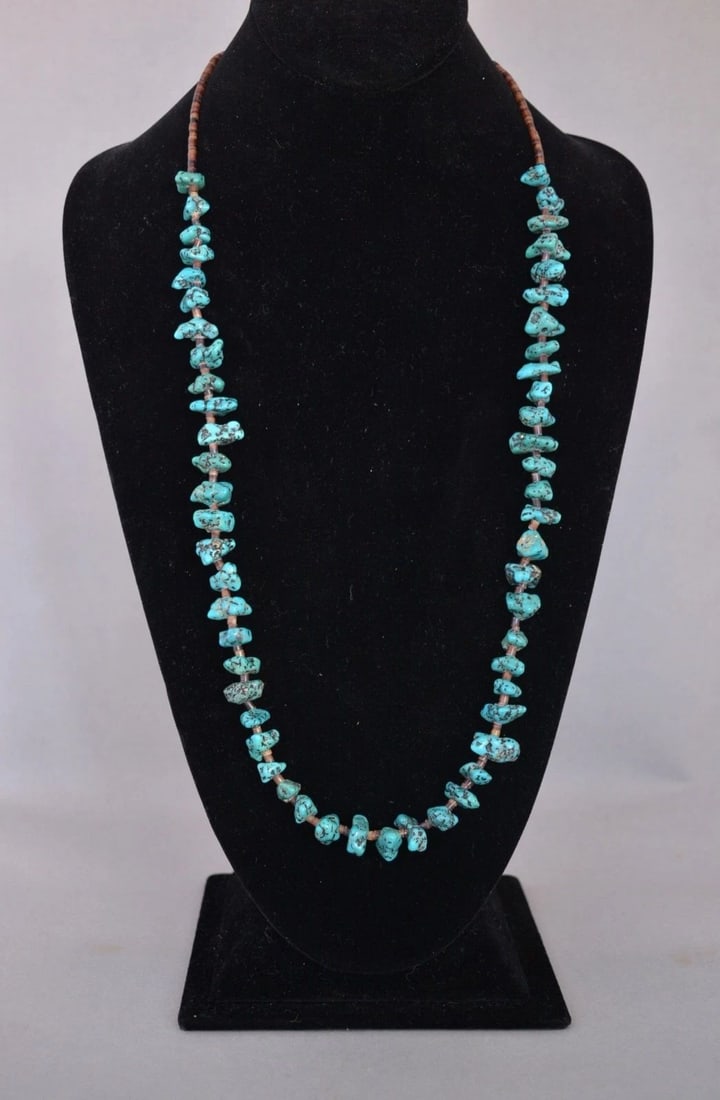 OLD PAWN NAVAJO BEAD NECKLACE - TURQUOISE NUGGETS AND FINE HEISHI - 29.5" LONG: OLD PAWN NAVAJO BEAD NECKLACE - TURQUOISE NUGGETS AND FINE HEISHI - 29.5" LONG This vintage Navajo necklace has turquoise nuggets alternating with fine olive shell heishi. It is 29.5" long. It is in g