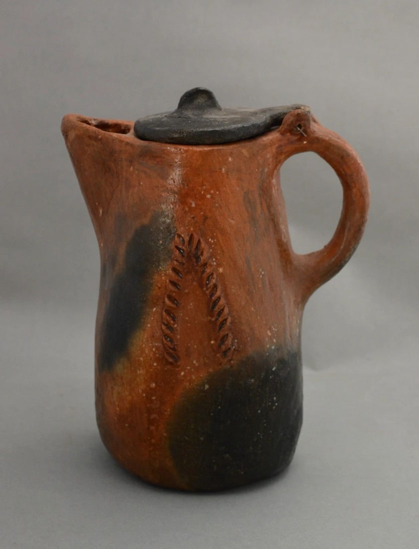 VINTAGE DINE / NAVAJO PINON PITCH CLAY PITCHER - COFFEE POT W LID - 8.75" TALL: VINTAGE DINE / NAVAJO PINON PITCH CLAY PITCHER - COFFEE POT W LID - 8.75" TALL This Dine pitcher / coffee pot is 8 3/4" tall and 7" from spout to handle. The Dine (Navajo) often made pottery for their