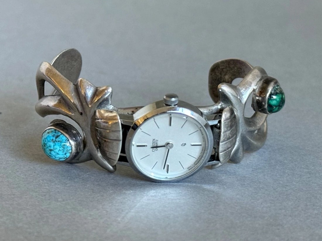 VINTAGE NAVAJO STERLING SILVER CAST WATCH BRACELET WITH TURQUOISE.: VINTAGE NAVAJO STERLING SILVER CAST WATCH BRACELET WITH TURQUOISE. Vintage Navajo Sterling Silver Cast Watch Bracelet with Turquoise. 1" Wide .. 4 1/2" Inside with a 1 3/8" Opening ..1.5oz ..