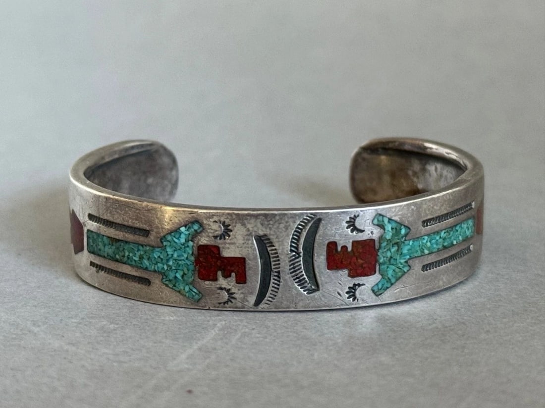OLD PAWN NAVAJO STERLING SILVER WITH INLAID TURQUOISE AND CORAL KACHINA BRACELET: OLD PAWN NAVAJO STERLING SILVER WITH INLAID TURQUOISE AND CORAL KACHINA BRACELET Old Pawn Navajo Sterling Silver with Inlaid Turquoise and Coral Kachina Bracelet 1/2" wide ... 4 3/4" Around Inside .. 