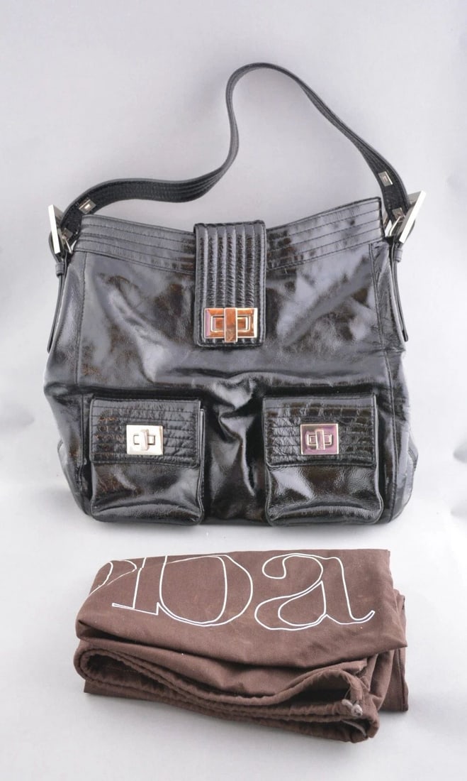 AUTHENTIC KOOBA HANDBAG LARGE BLACK TOTE WITH DUST BAG - GREAT CONDITION: AUTHENTIC KOOBA HANDBAG LARGE BLACK TOTE WITH DUST BAG - GREAT CONDITION This vintage Kooba black patent leather tote comes with its original dust bag. It measures 14" across x 13" tall x 4.5" deep. I