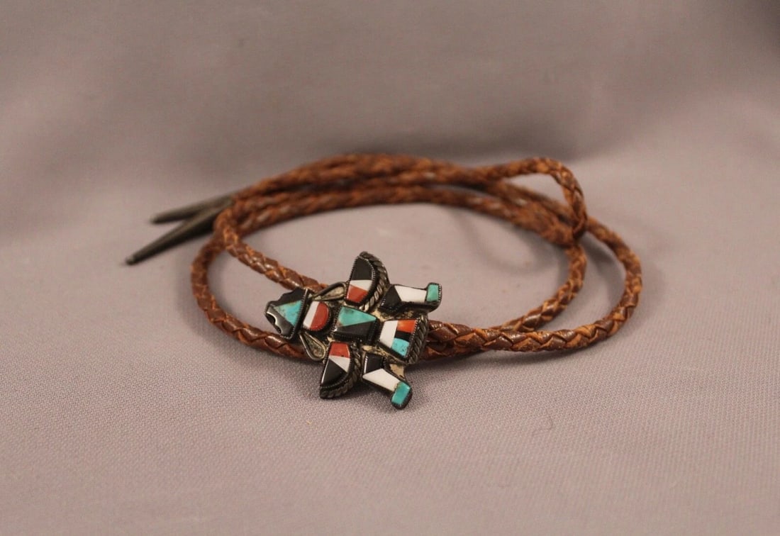 OLD PAWN.. ZUNI KNIFE WING.. BOLO TIE STERLING SILVER AND MIXED STONES: OLD PAWN.. ZUNI KNIFE WING.. BOLO TIE STERLING SILVER AND MIXED STONES Item Description: Great Old Zuni Bolo Tie ..1 1/2 High 1 1/4 wide Silver Tips Great shape ..