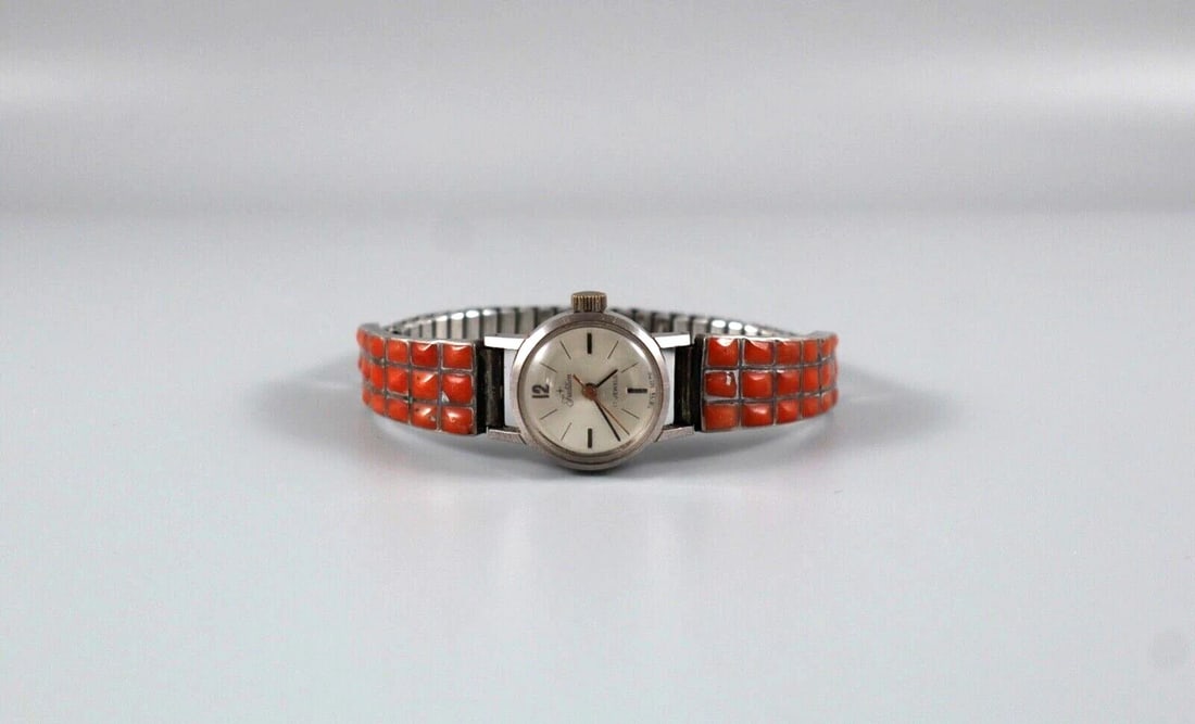 OLD PAWN ZUNI STERLING AND CORAL WATCHBAND WOMENS SWISS WATCH 17 JEWELS: OLD PAWN ZUNI STERLING AND CORAL WATCHBAND WOMENS SWISS WATCH 17 JEWELS Item Description: 1/2 " Wide X 1 1/8 " Long Coral Band ..Working self Wind Swiss Watch 17 Jewel Traditions ..