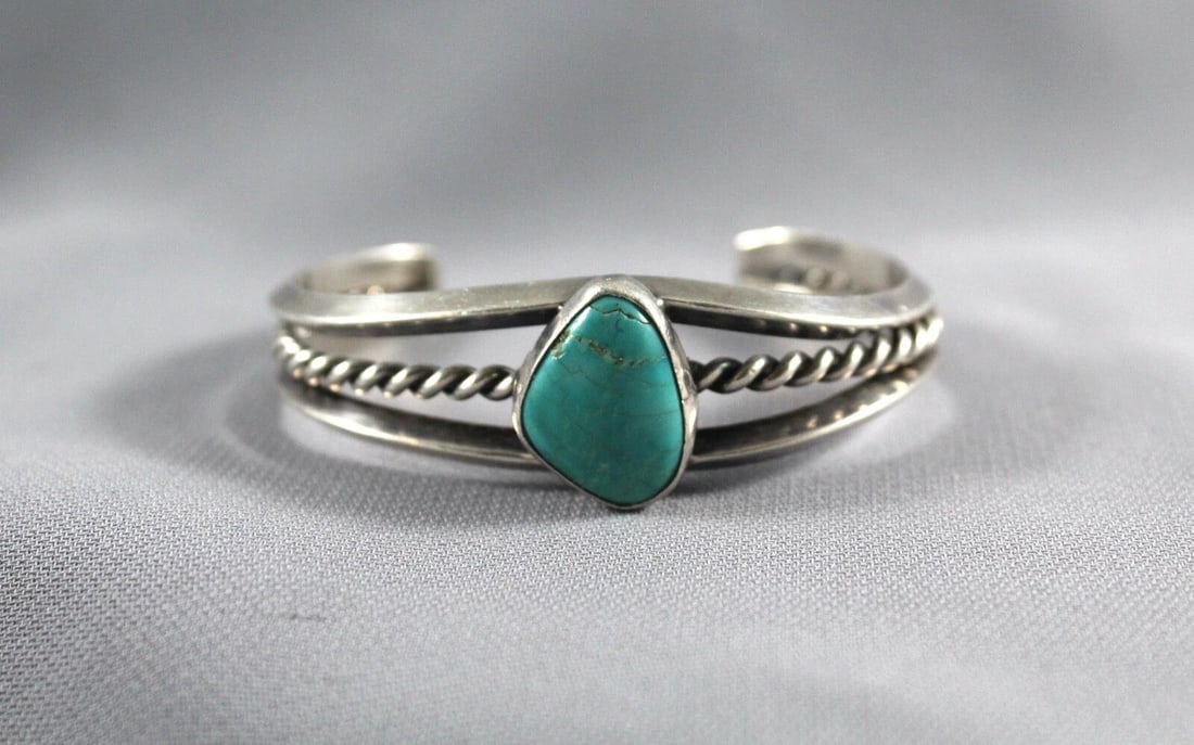 OLD PAWN NAVAJO STERLING SILVER AND TURQUOISE BRACELET - SIZE 6 1/4": OLD PAWN NAVAJO STERLING SILVER AND TURQUOISE BRACELET - SIZE 6 1/4" Item Description: This bracelet is 3/4 " wide at the center front. The size is 5 " around the inside plus an additional 1 1/4 " ope