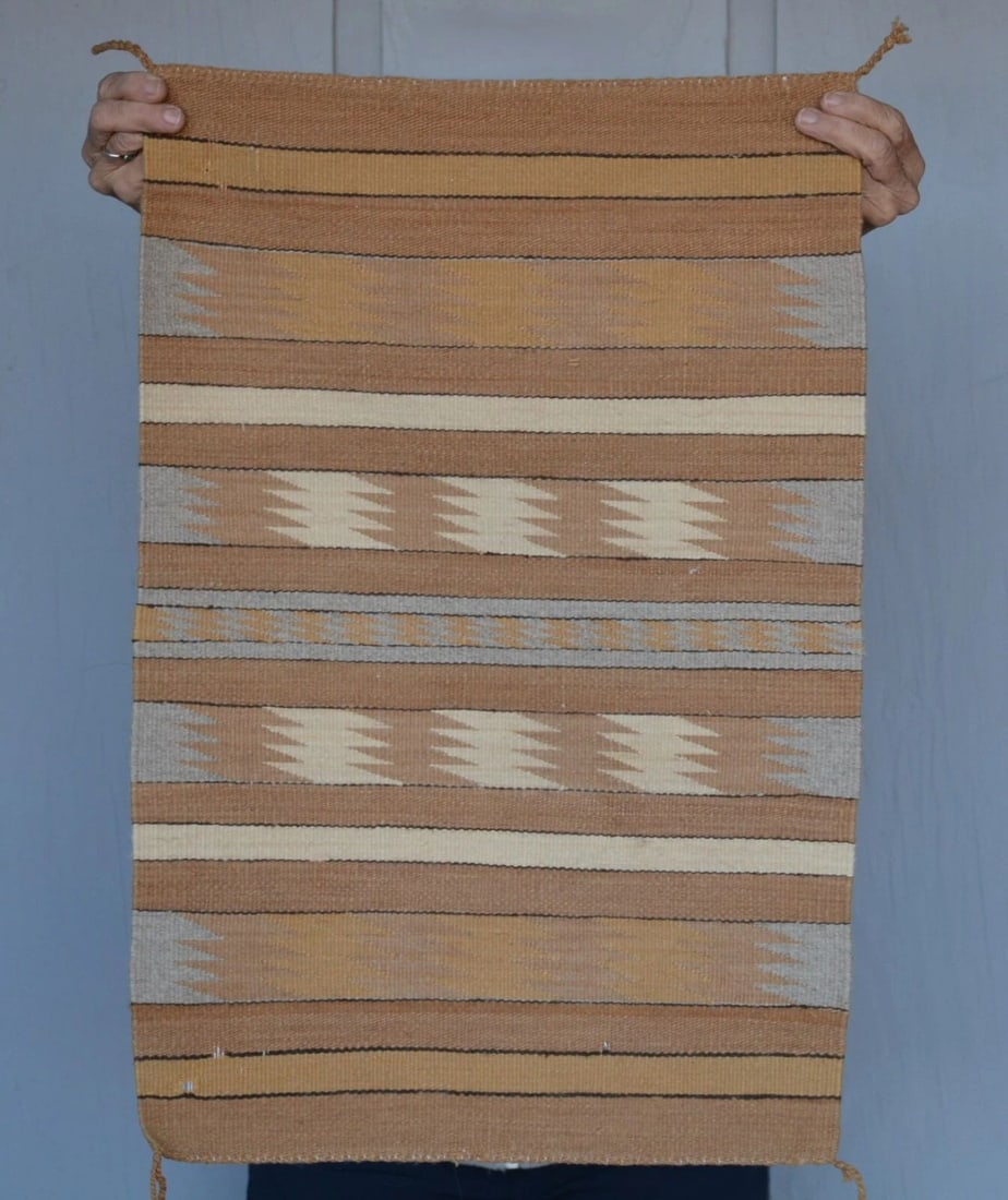 FINELY WOVEN CHINLE NAVAJO RUG - VINTAGE - TANS GRAYS WHITE - 26" X 17": FINELY WOVEN CHINLE NAVAJO RUG - VINTAGE - TANS GRAYS WHITE - 26" X 17" This finely woven Chinle Navajo rug is in good condition except for a couple of old small holes from moths near the bottom.
