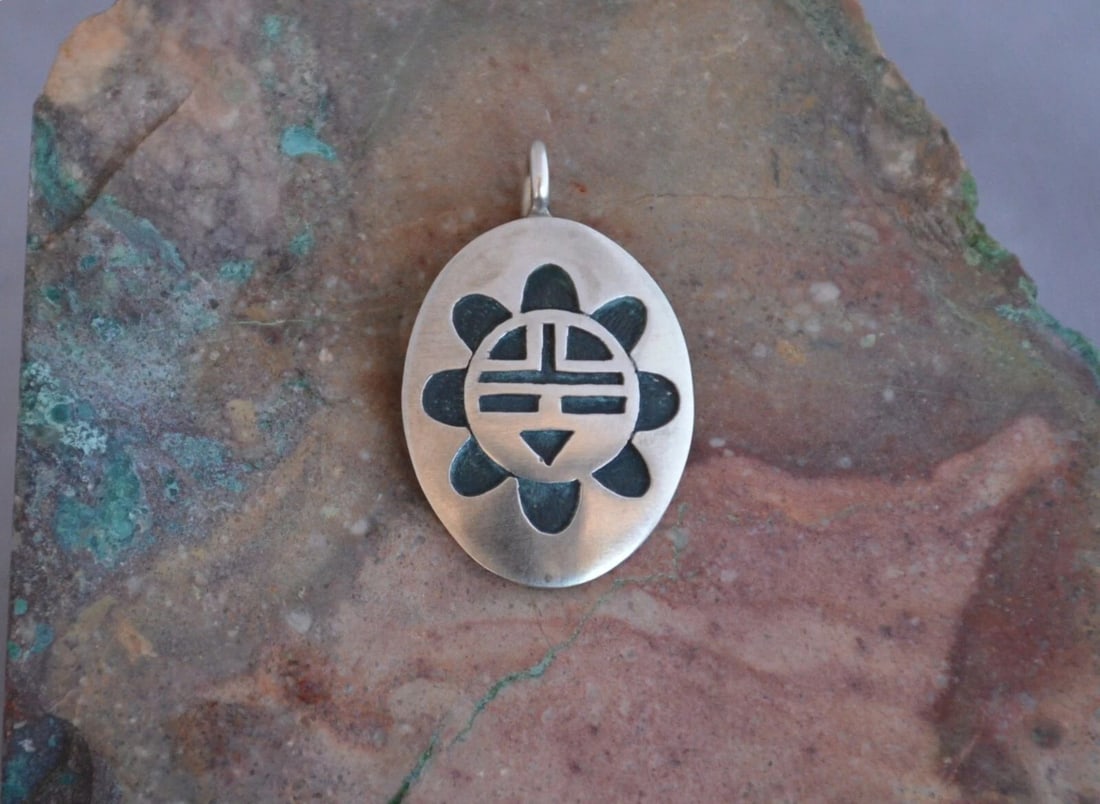MANUEL HOYUNGOWA (1953-2011) - HOPI STERLING SILVER PENDANT - SUN FACE - 1.5" (1 of 2)