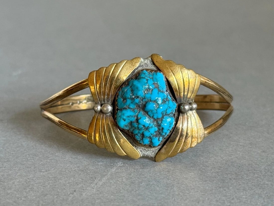 VINTAGE NAVAJO STERLING SILVER GOLD FACE WITH TURQUOISE NUGGET BRACELET: VINTAGE NAVAJO STERLING SILVER GOLD FACE WITH TURQUOISE NUGGET BRACELET Vintage Navajo Sterling Silver Gold Face with Turquoise Nugget Bracelet ..1 1/8" Wide ..5 1/2" around Inside With 1 1/4" Opening