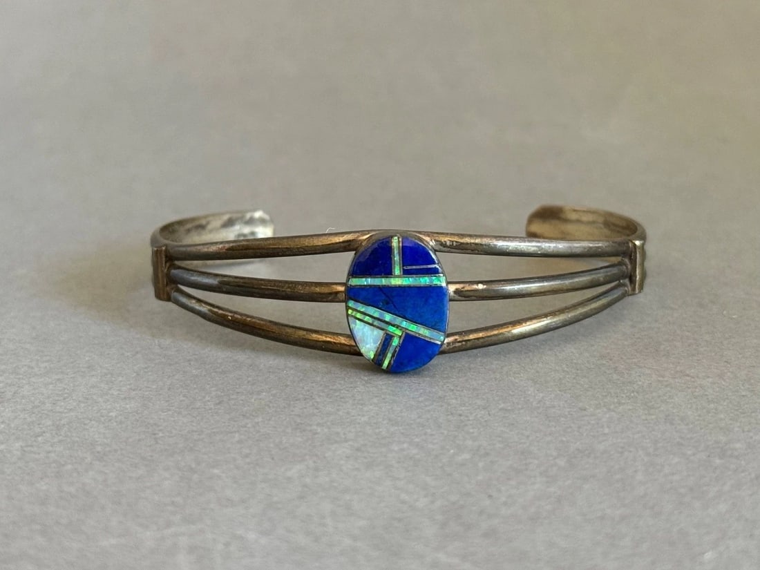 VINTAGE ZUNI STERLING SILVER WITH INLAID LAPIS AND OPAL: VINTAGE ZUNI STERLING SILVER WITH INLAID LAPIS AND OPAL Vintage Zuni Sterling Silver with Inlaid Lapis Lazuli and Opal ..5/8 " 5 1/8" Inside Around .. With a 1 1/2 " Opening ..
