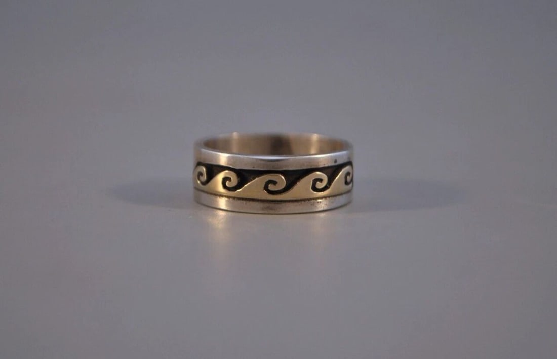 SOLID 14 KT. GOLD ON STERLING SILVER NAVAJO RING SCOTT SKEETS - 4 3/4: SOLID 14 KT. GOLD ON STERLING SILVER NAVAJO RING SCOTT SKEETS - 4 3/4 This is a new Navajo sterling silver ring with a solid 14 Karat wave design. It has been handcrafted by Navajo artist Scott Skeets