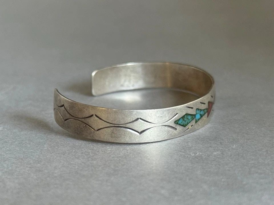 OLD PAWN NAVAJO STERLING SILVER WITH INLAID TURQUOISE AND CORAL CHIPS BRACELET: OLD PAWN NAVAJO STERLING SILVER WITH INLAID TURQUOISE AND CORAL CHIPS BRACELET Old Pawn Navajo Sterling Silver with Inlaid Turquoise and Coral Chips Bracelet ..3/8" Wide .. 5 1/2" Around Inside .. Wit