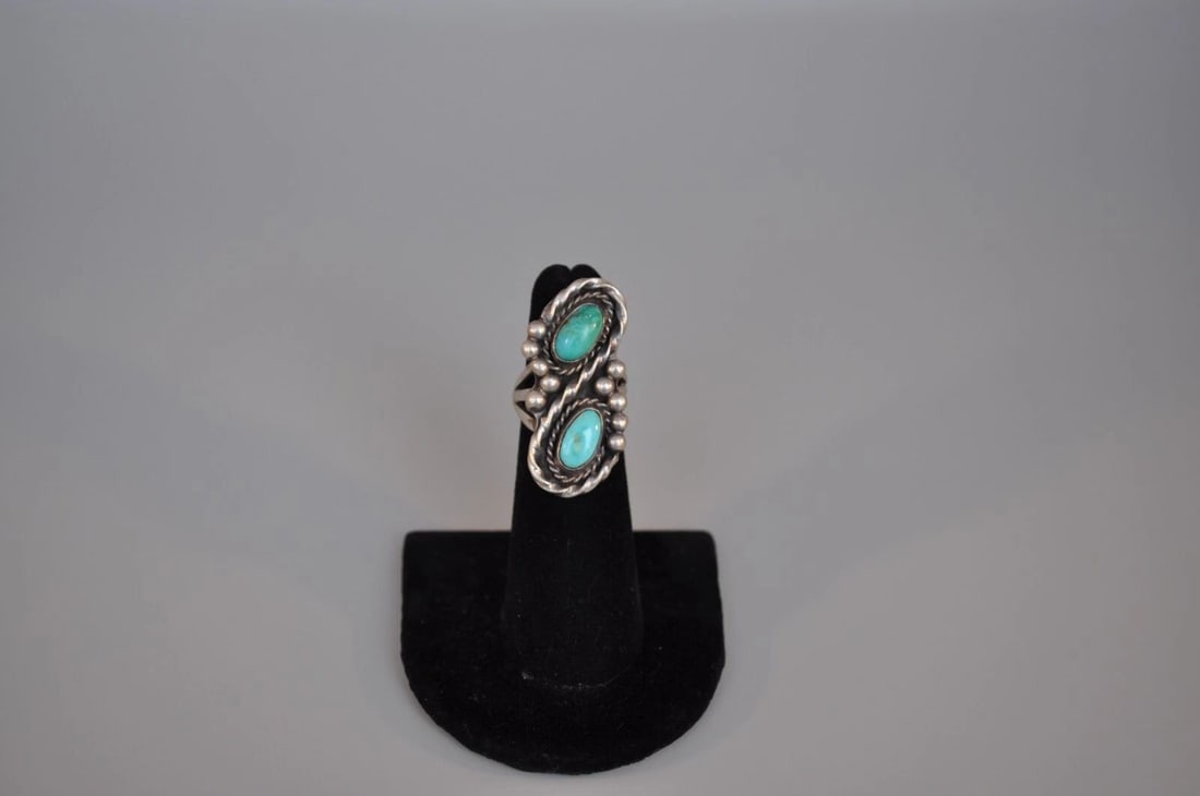 OLD PAWN NAVAJO SILVER RING - TURQUOISE SIZE 4 1/2: OLD PAWN NAVAJO SILVER RING - TURQUOISE SIZE 4 1/2 Weight 10.12 Grams 1 3/8" tall Old Pawn Jewelry dates from the early 1900s to the 1970s. Most of it is not signed because it wasn't the Native Americ