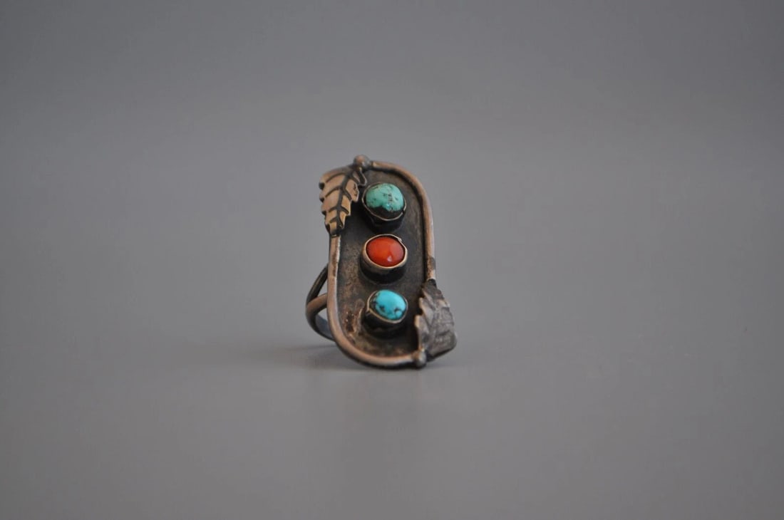 OLD PAWN NAVAJO STERLING SILVER RING - TURQUOISE, CORAL SIZE 5 1/4: OLD PAWN NAVAJO STERLING SILVER RING - TURQUOISE, CORAL SIZE 5 1/4 Weight 6.76 Grams 1 3/8" Tall Old Pawn Jewelry dates from the early 1900s to the 1970s. Most of it is not signed because it wasn't th