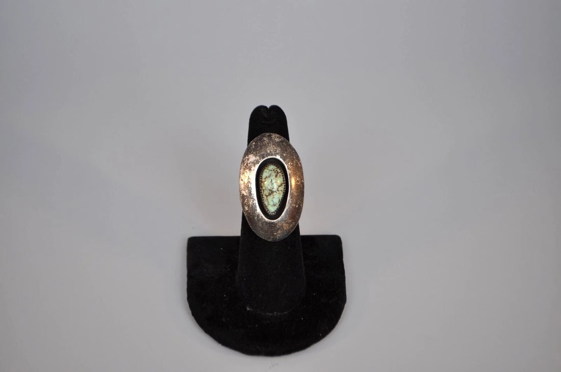 OLD PAWN NAVAJO STERLING SILVER RING - TURQUOISE SIZE 6 1/4: OLD PAWN NAVAJO STERLING SILVER RING - TURQUOISE SIZE 6 1/4 Weight 10.67 Grams 1 3/8" Tall Old Pawn Jewelry dates from the early 1900s to the 1970s. Most of it is not signed because it wasn't the Nati