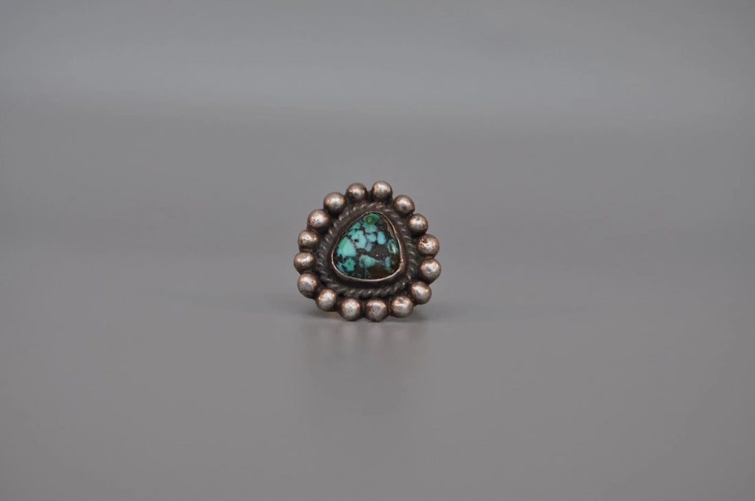 OLD PAWN NAVAJO STERLING SILVER RING - TURQUOISE SIZE 6 1/2: OLD PAWN NAVAJO STERLING SILVER RING - TURQUOISE SIZE 6 1/2 Weight 8.16 Grams 7/8' tall Old Pawn Jewelry dates from the early 1900s to the 1970s. Most of it is not signed because it wasn't the Native 