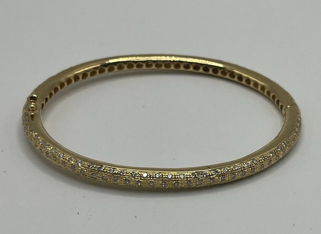 7" 18K YELLOW GOLD BANGLE WITH DIAMONDS 23.8 GRAMS: 7" 18K YELLOW GOLD BANGLE WITH DIAMONDS 23.8 GRAMS 7" 18K YELLOW GOLD BANGLE WITH DIAMONDS 23.8 GRAMS This exquisite bangle bracelet is made of 18k yellow gold and adorned with 218 round-shaped diamon