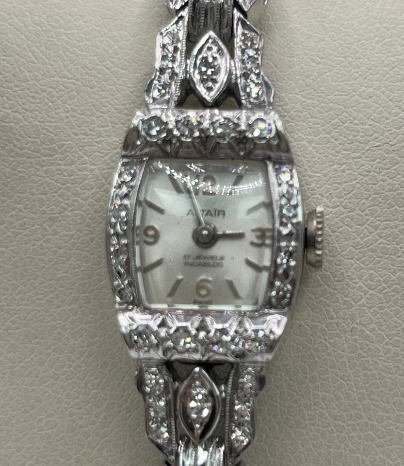 ALTAIR DIAMOND AND 14K WHITE GOLD LADIES WATCH SWISS MADE: ALTAIR DIAMOND AND 14K WHITE GOLD LADIES WATCH SWISS MADE ALTAIR DIAMOND AND 14K WHITE GOLD LADIES WATCH SWISS MADE Very elegant Ladies 14K White Gold and Diamond watchWatch has 74 Round Single Cut Di