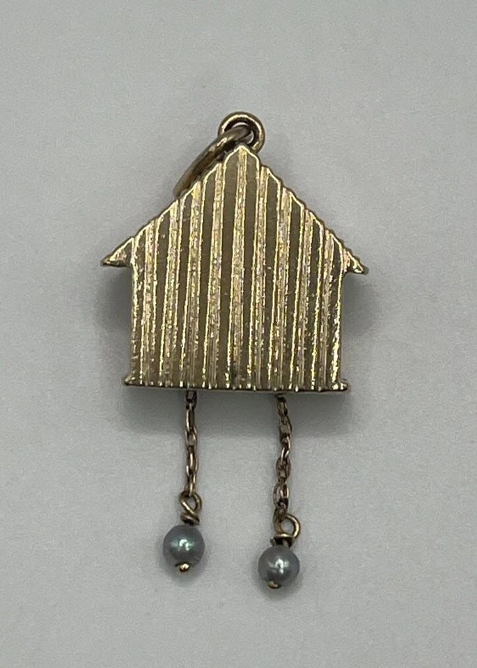 14K YELLOW GOLD COO COO CLOCK WITH PEARLS AND 5 GEMSTONES: 14K YELLOW GOLD COO COO CLOCK WITH PEARLS AND 5 GEMSTONES 14K YELLOW GOLD COO COO CLOCK WITH PEARLS AND 5 GEMSTONES This unique 14K yellow gold pendant features a charming clock design, accented with 