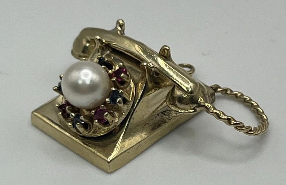 14K YELLOW GOLD TELEPHONE WITH PEARL AND LAB CREATED RUBIES AND SAPPHIRES: 14K YELLOW GOLD TELEPHONE WITH PEARL AND LAB CREATED RUBIES AND SAPPHIRES 14K YELLOW GOLD TELEPHONE WITH PEARL AND LAB CREATED RUBIES AND SAPPHIRES This 14K Yellow Gold Pendant features a telephone de