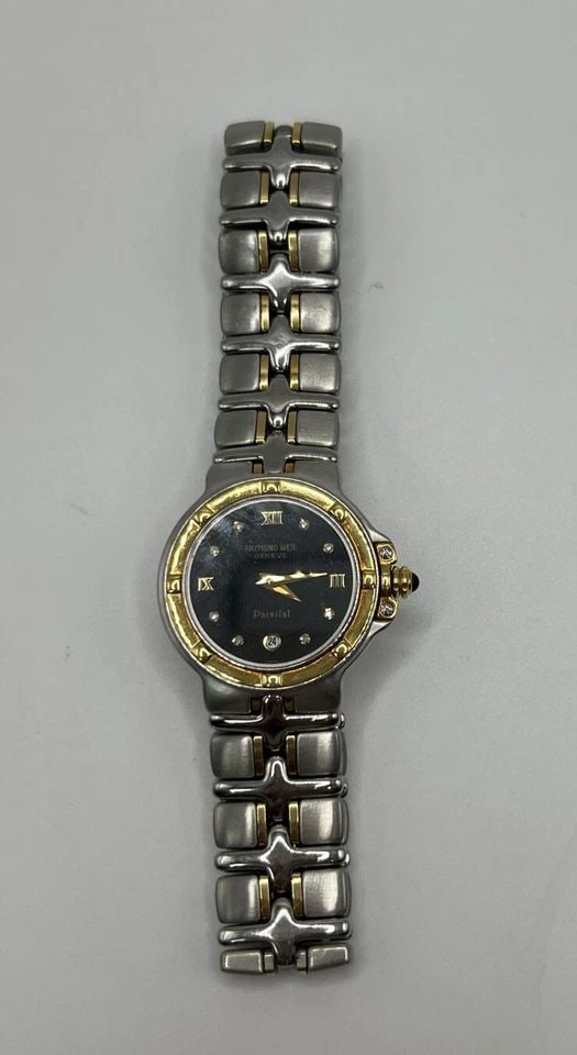 RAYMOND WEIL PARSIFAL 9990 BLACK DIAMOND DIAL GOLD WOMEN'S WATCH: RAYMOND WEIL PARSIFAL 9990 BLACK DIAMOND DIAL GOLD WOMEN'S WATCH RAYMOND WEIL PARSIFAL 9990 BLACK DIAMOND DIAL GOLD WOMEN'S WATCH This exquisite Raymond Weil Parsifal women's watch is a true masterpie