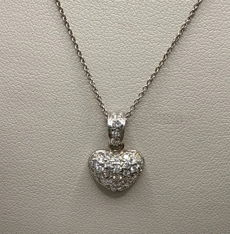 18K ROBERTO COIN TINY TREASURES DIAMOND PUFFED HEART NECKLACE: 18K ROBERTO COIN TINY TREASURES DIAMOND PUFFED HEART NECKLACE The 18K Roberto Coin Tiny Treasures Diamond Puffed Heart Necklace is a stunning piece of fine jewelry featuring a charming, puffed heart p