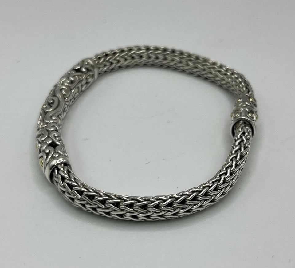 JOHN HARDY 925 STERLING SILVER AND 18K YELLOW GOLD BRACELET: JOHN HARDY 925 STERLING SILVER AND 18K YELLOW GOLD BRACELET JOHN HARDY 925 STERLING SILVER AND 18K YELLOW GOLD BRACELET John Hardy 7.5" BraceletSterling Silver and 18K Yellow Gold Weight is approximat