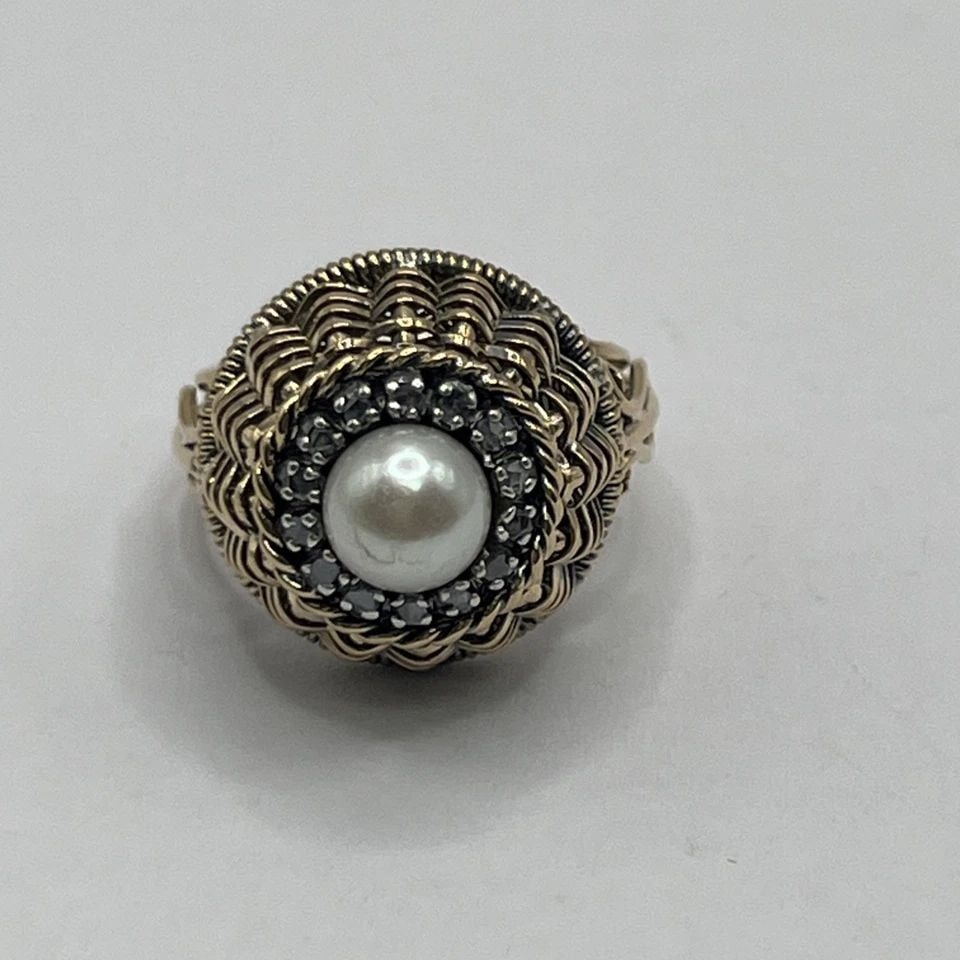 14K Y/G BASKET WEAVE RING SIZE 5.5 WITH PEARL & COLORLESS STONES: 14K Y/G BASKET WEAVE RING SIZE 5.5 WITH PEARL & COLORLESS STONES 14K Y/G BASKET WEAVE RING SIZE 5.5 WITH PEARL & COLORLESS STONES 7.8 grams This 14K yellow gold ring features a basket weave design and