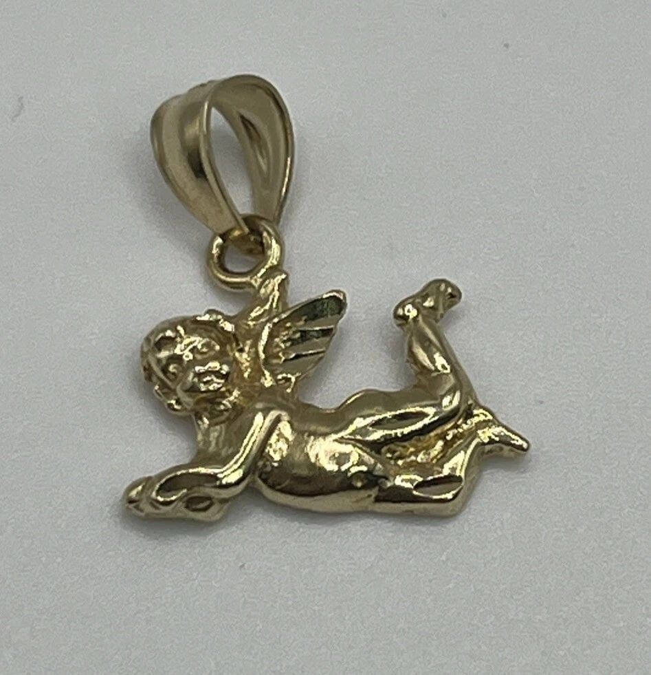 14K YELLOW GOLD ANGEL CHARM: 14K YELLOW GOLD ANGEL CHARM 14K YELLOW GOLD ANGEL CHARM Elevate your jewelry collection with this exquisite 14K yellow gold Angel Charm. Crafted with precision, this piece features an angel-shaped pen