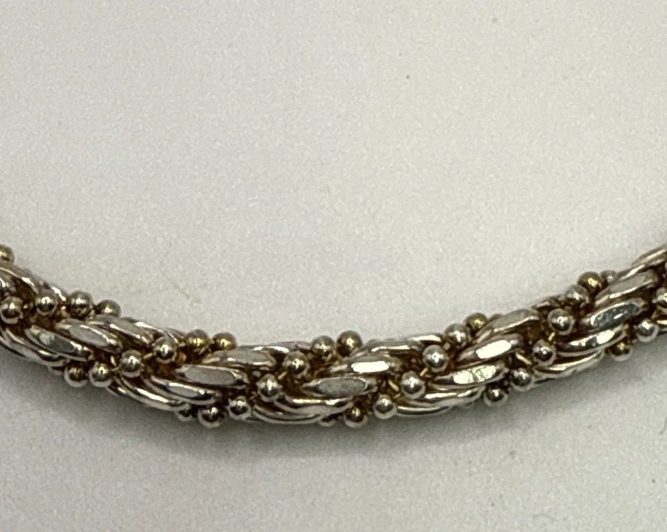 TWO TONE STERLING SILVER 7" BRACELET 16.4 GRAMS: TWO TONE STERLING SILVER 7" BRACELET 16.4 GRAMS This two-tone sterling silver 7" bracelet weighs 16.4 grams and features a classic chain style. Made from high-quality 925 sterling silver, this bracele