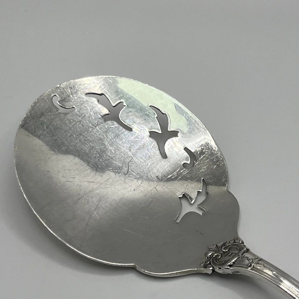 BURGUNDY BY REED AND BARTON TOMATO SERVING SPOON: BURGUNDY BY REED AND BARTON TOMATO SERVING SPOON BURGUNDY BY REED AND BARTON TOMATO SERVING SPOON This beautiful Tomato serving spoon by Reed & Barton features a stunning pattern that is sure to impre