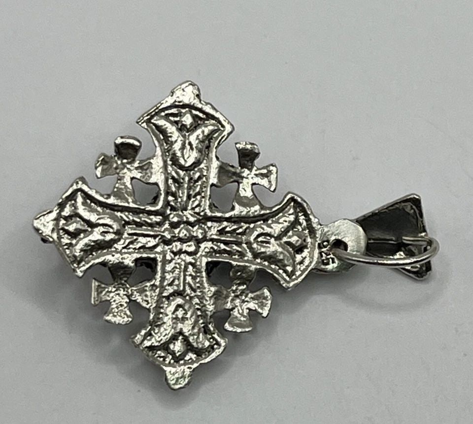 STERLING SILVER JERSALEM CROSS PENDANT 9.3 GRAMS: Sterling Silver Jersalem Cross Pendant 9.3 grams The Sterling Silver Jerusalem Cross Pendant weighs 9.3 grams and features the shape of a cross. Made of 925 sterling silver, this pendant has a sleek s