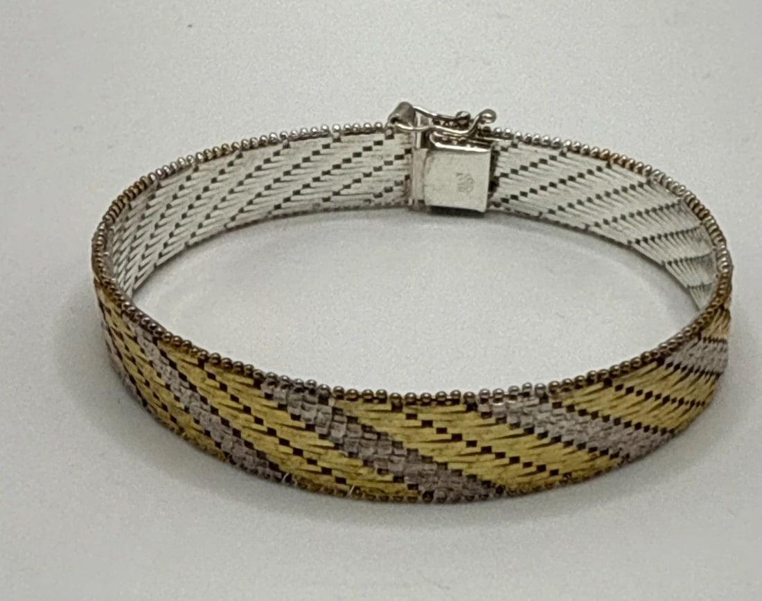 STERLING SILVER TWO TONE WOVEN 7.5" BRACELET 30 GRAMS: STERLING SILVER TWO TONE WOVEN 7.5" BRACELET 30 GRAMS This sterling silver two tone woven bracelet is a stylish and elegant piece of fine jewelry. The intricate weaving of the sterling silver creates 