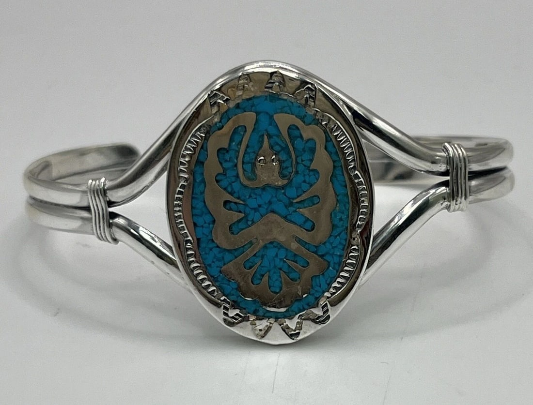 STERLING SILVER CUFF BRACELET WITH TURQUOISE INLAY - BIRD PATTERN: STERLING SILVER CUFF BRACELET WITH TURQUOISE INLAY - BIRD PATTERN STERLING SILVER CUFF BRACELET WITH TURQUOISE INLAY - BIRD PATTERN This exquisite bracelet features a stunning bird pattern with intric