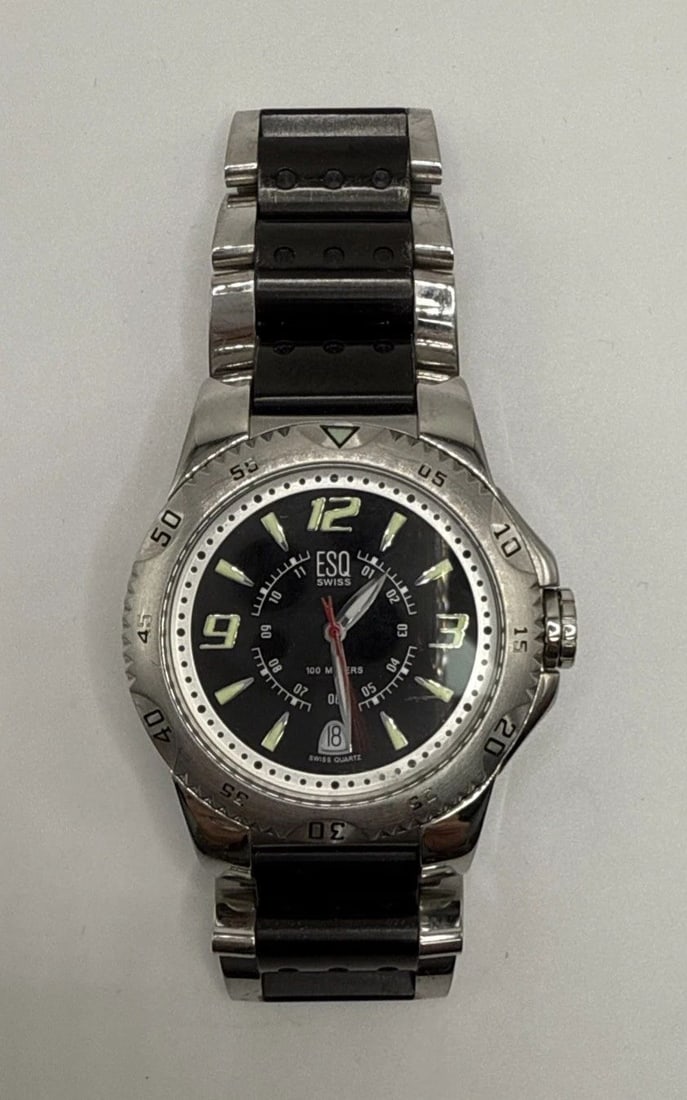 ESQ BY MOVADO E5370 MEN'S WATCH: ESQ BY MOVADO E5370 MEN'S WATCH The ESQ by MOVADO E5370 Men's Watch is a stylish and vintage timepiece with a silver stainless steel case and bezel. This round watch features Arabic numerals and stick