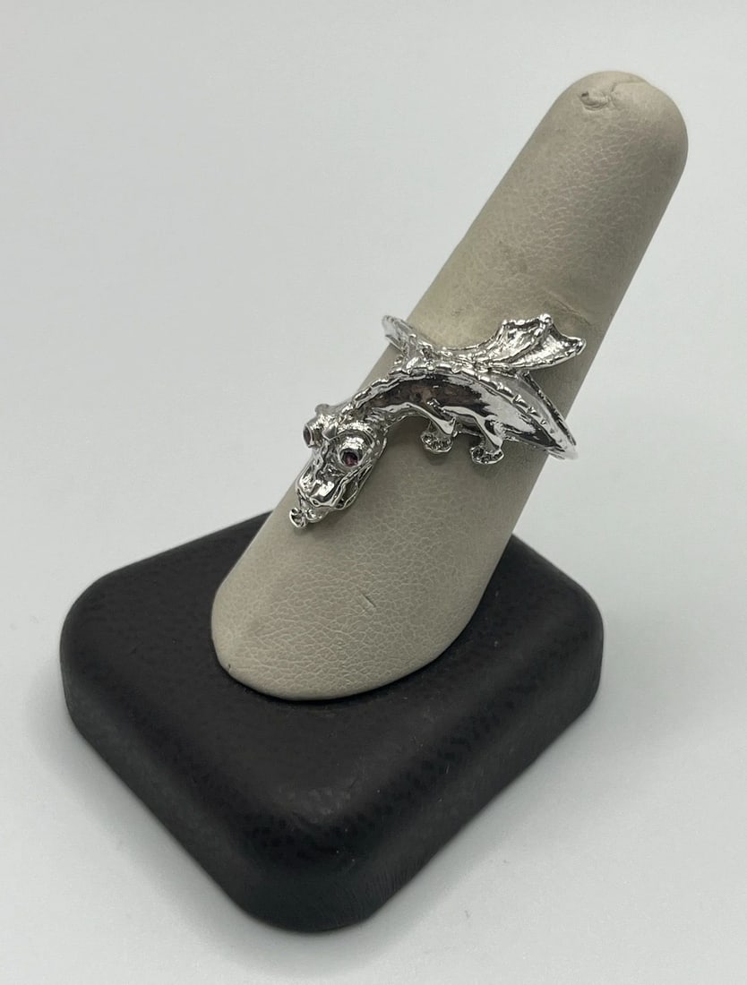 STERLING SILVER SIZE 9.25 DRAGON RING WITH RUBY EYES: STERLING SILVER SIZE 9.25 DRAGON RING WITH RUBY EYES STERLING SILVER SIZE 9.25 DRAGON RING WITH RUBY EYES This exquisite dragon ring is a must-have for anyone who loves fine jewelry. Made of sterling 