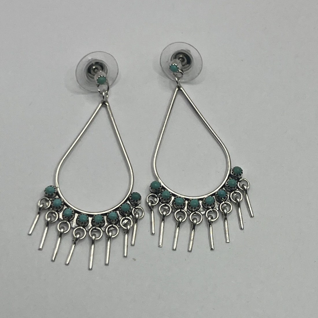ZUNI STERLING SILVER WITH TURQUOISE FRINGE DANGLE EARRINGS: ZUNI STERLING SILVER WITH TURQUOISE FRINGE DANGLE EARRINGS ZUNI STERLING SILVER WITH TURQUOISE FRINGE DANGLE EARRINGS These Zuni Sterling Silver earrings feature a Native American design with turquois