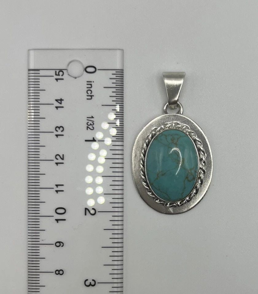 STERLING SILVER & TURQUOISE PENDANT MADE IN MEXICO: STERLING SILVER & TURQUOISE PENDANT MADE IN MEXICO STERLING SILVER & TURQUOISE PENDANT MADE IN MEXICO This beautiful pendant is made of sterling silver and features a stunning oval-shaped Turquoise st