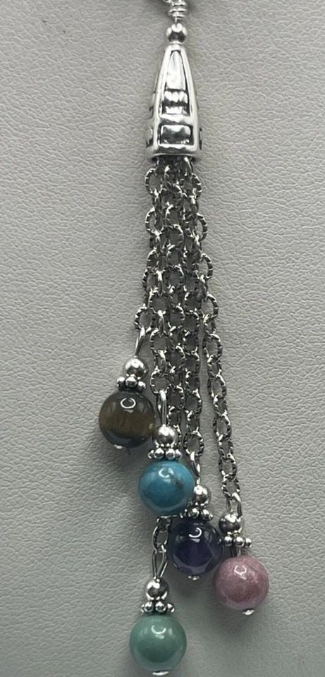 STERLING SILVER DOUBLE LAYER NECKLACE WITH MULTI-COLORED BEADS & TASSEL: STERLING SILVER DOUBLE LAYER NECKLACE WITH MULTI-COLORED BEADS & TASSEL STERLING SILVER DOUBLE LAYER NECKLACE WITH MULTI-COLORED BEADS & TASSEL This Sterling Silver Double Layer Necklace features a st
