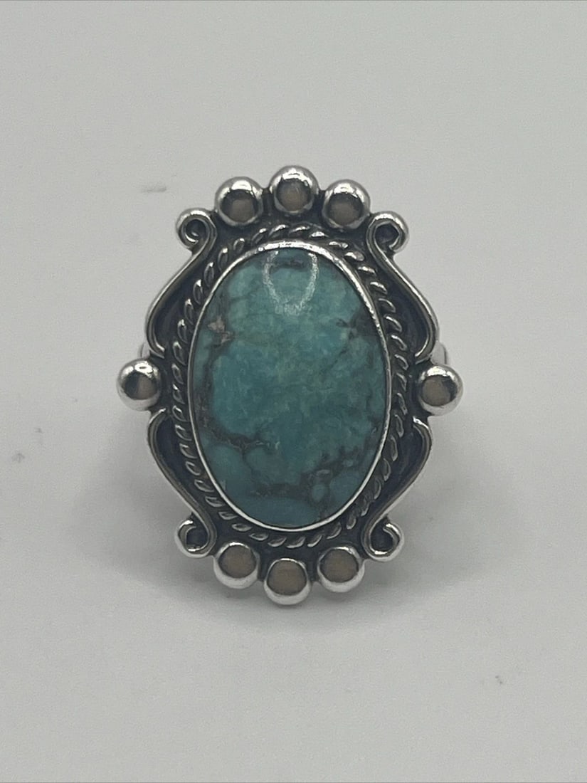 STERLING SILVER & TURQUOISE RING SIZE 6: STERLING SILVER & TURQUOISE RING SIZE 6 STERLING SILVER & TURQUOISE RING SIZE 6 This beautiful ring is a must-have for any jewelry collection. Crafted from sterling silver and featuring a stunning tur