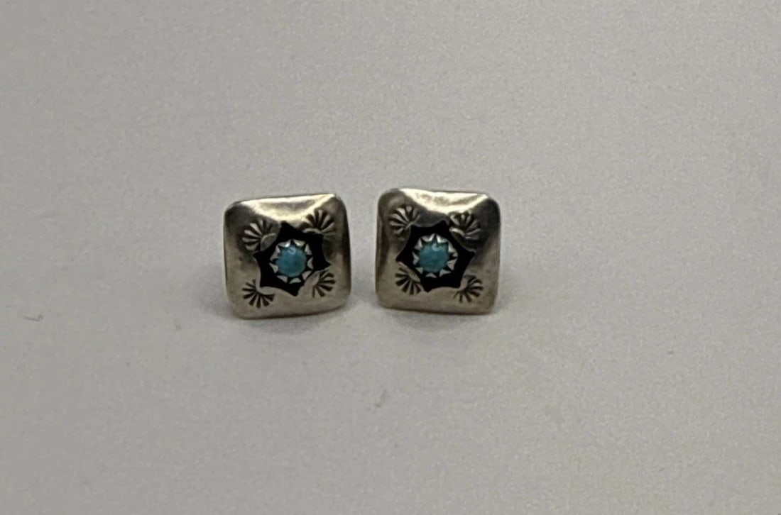 STERLING SILVER SOUTHWESTERN STUD EARRINGS WITH TURQUOISE: STERLING SILVER SOUTHWESTERN STUD EARRINGS WITH TURQUOISE STERLING SILVER SOUTHWESTERN STUD EARRINGS WITH TURQUOISE Delve into the rich heritage of Southwestern design with these Sterling Silver stud 