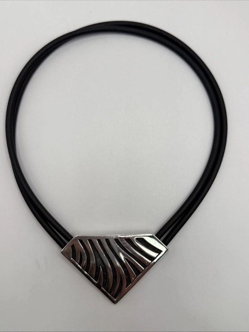 STERLING SILVER PENDANT ON DOUBLE RUBBER CORD CHOKER NECKLACE 15": STERLING SILVER PENDANT ON DOUBLE RUBBER CORD CHOKER NECKLACE 15" This product is a Sterling Silver Pendant on a Double Rubber Cord Choker Necklace, measuring 15 inches in length. The pendant is craft