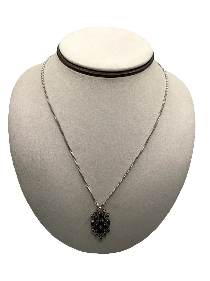 STERLING SILVER 18" NECKLACE WITH PENDANT - GREEN STONES AND MARCASITE: STERLING SILVER 18" NECKLACE WITH PENDANT - GREEN STONES AND MARCASITE This sterling silver necklace features a beautiful pendant adorned with green stones and marcasite. The elegant design and high-q