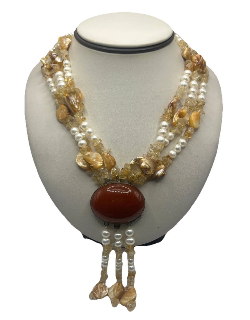 20" STATEMENT NECKLACE WITH LARGE RED STONE, PEARLS & GLASS STONES: 20" STATEMENT NECKLACE WITH LARGE RED STONE, PEARLS & GLASS STONES 20" STATEMENT NECKLACE WITH LARGE RED STONE, PEARLS & GLASS STONES This statement necklace features an oval-shaped large red stone as