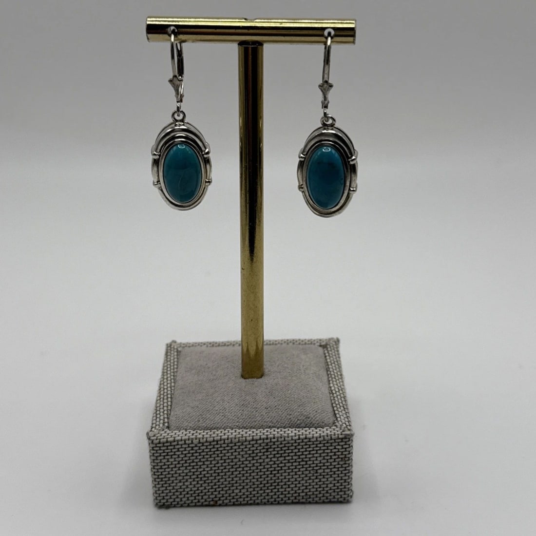 WHITNEY KELLY 925 STERLING DANGLE FRAMED TURQUOISE EARRINGS: WHITNEY KELLY 925 STERLING DANGLE FRAMED TURQUOISE EARRINGS WHITNEY KELLY 925 STERLING DANGLE FRAMED TURQUOISE EARRINGS These Whitney Kelly 925 Sterling Dangle Framed Turquoise Earrings feature an ova