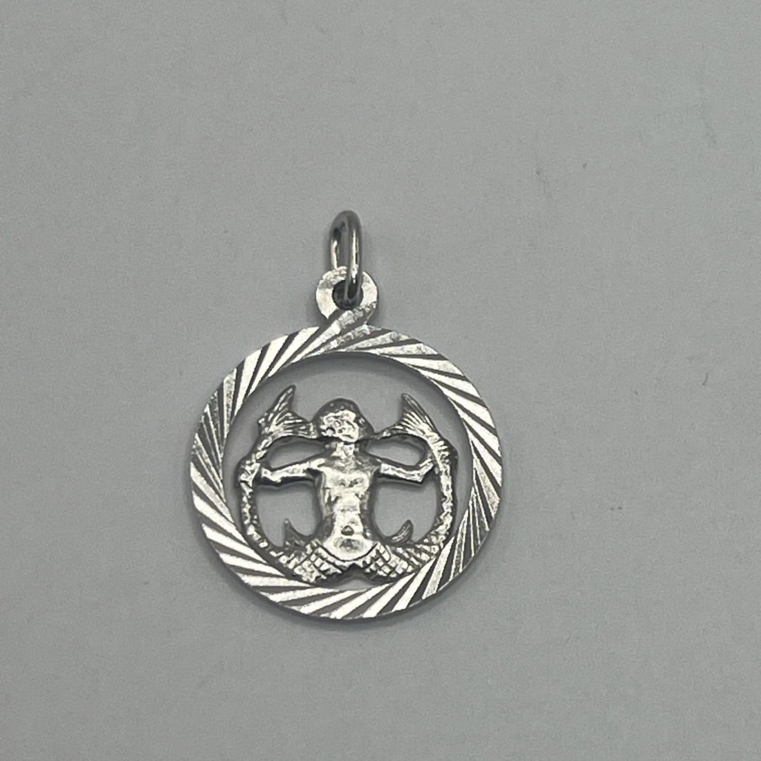 AQUARIUS STERLING SILVER CHARM: AQUARIUS STERLING SILVER CHARM AQUARIUS STERLING SILVER CHARM The "Aquarius Sterling Silver Charm" is a charm made of 925 sterling silver featuring the design of the Aquarius zodiac sign. This charm i