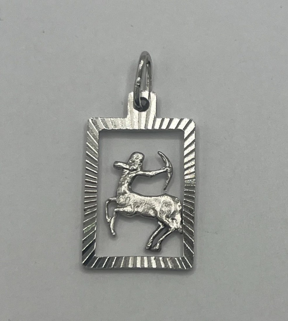 SAGITTARIUS STERLING SILVER CHARM: SAGITTARIUS STERLING SILVER CHARM SAGITTARIUS STERLING SILVER CHARM The "Sagittarius Sterling Silver Charm" is a charm made of 925 sterling silver featuring a design related to the zodiac sign Sagitta